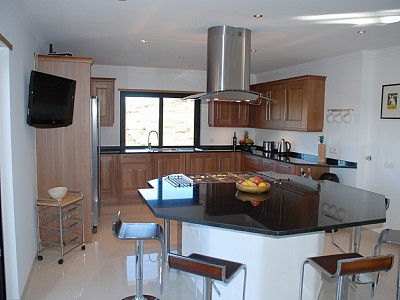 Spacious kitchen with central cooking island